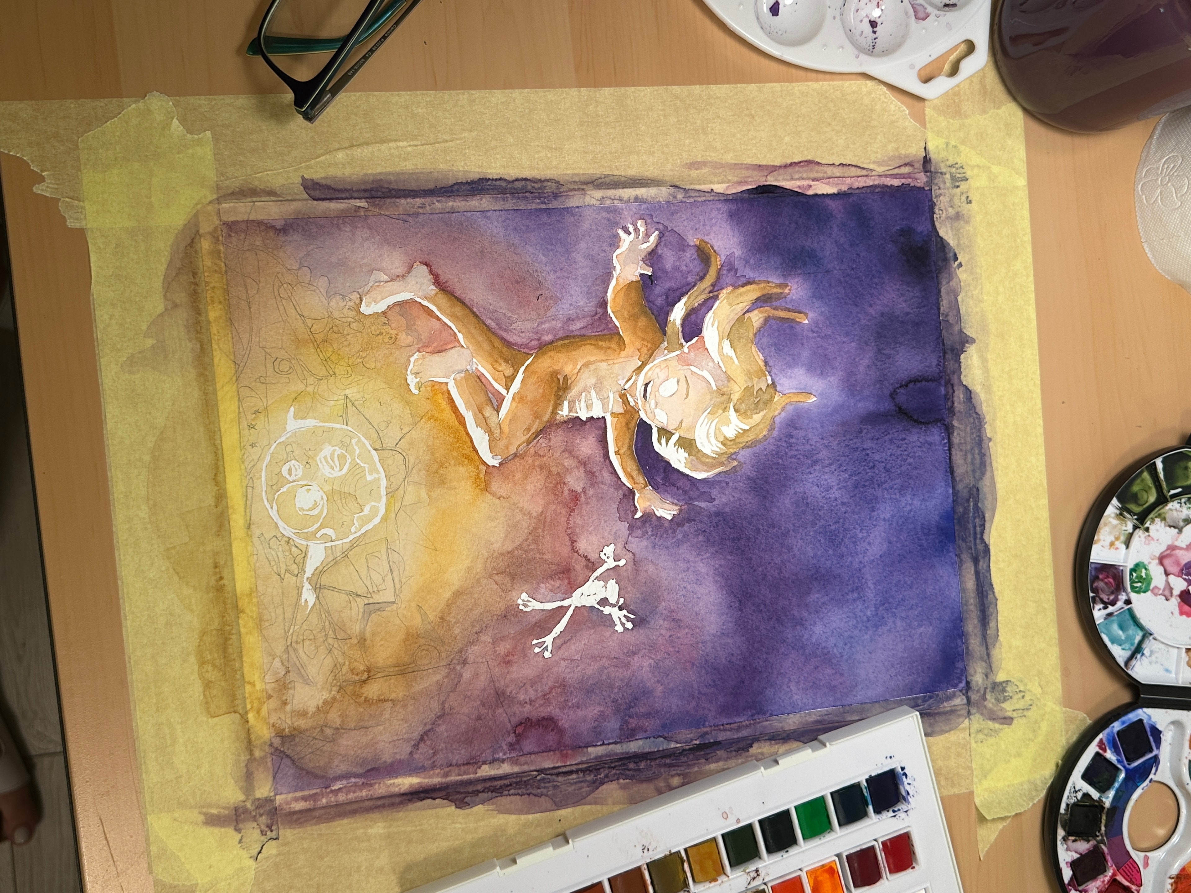 Watercolor painting process on an illustrator’s desk